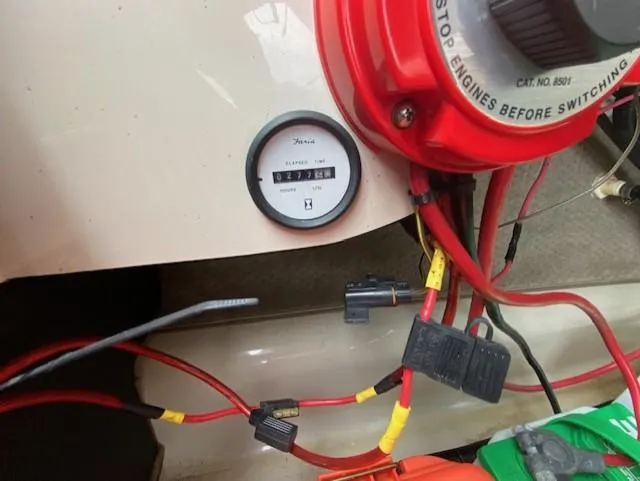 Slide: The Image of 2004 Glastron 185 GX boat dashboard with hour meter and wiring. - 9