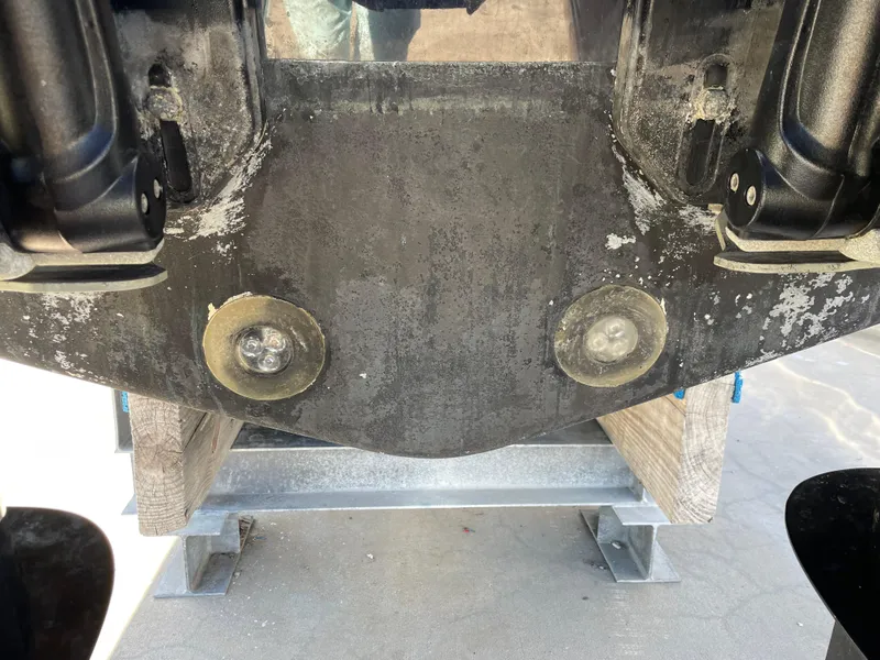 Slide: The Image of 2008 Intrepid 323 Cuddy boat hull with visible propeller mounts. - 13