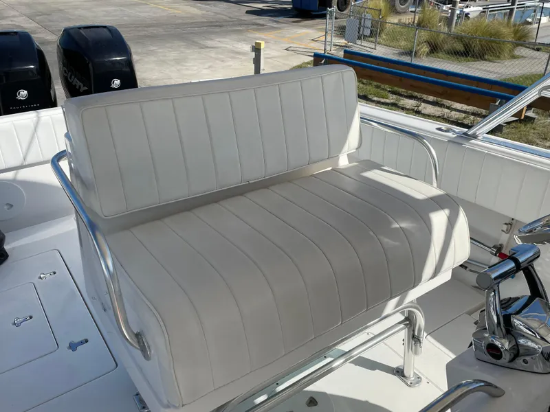 Slide: The Image of White cushioned seat on 2008 Intrepid 323 Cuddy boat deck. - 27