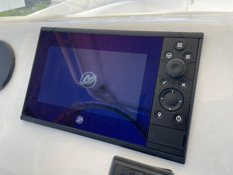 Slide: The Image of Boat dashboard with a digital display on a 2008 Intrepid 323 Cuddy. - 32
