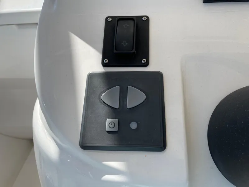 Slide: The Image of Control panel on a 2008 Intrepid 323 Cuddy boat dashboard. - 33