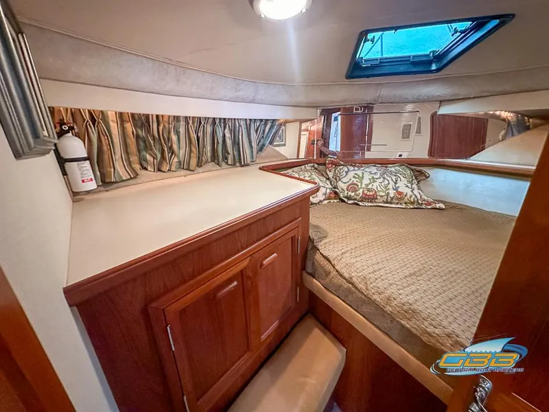 Slide: The Image of Cozy cabin interior of 1989 Carver 3807 Aft Cabin with bed and storage. - 20
