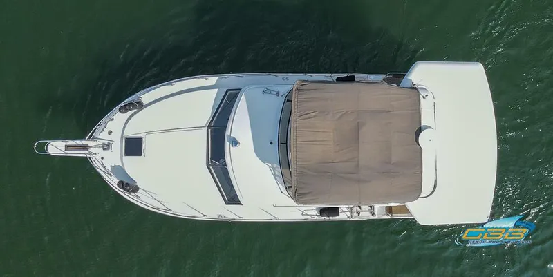 Slide: The Image of Aerial view of 1989 Carver 3807 Aft Cabin yacht on water. - 16
