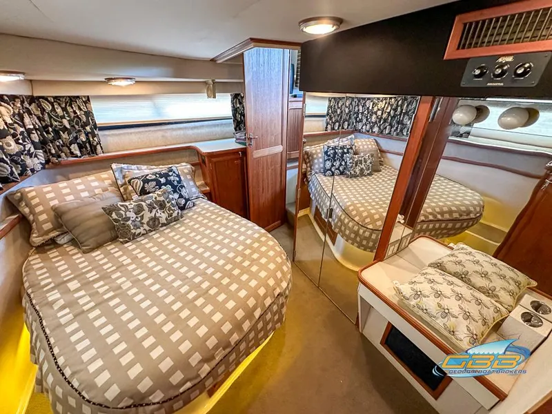 Slide: The Image of Interior of 1989 Carver 3807 Aft Cabin with cozy bed and mirrored closet. - 18