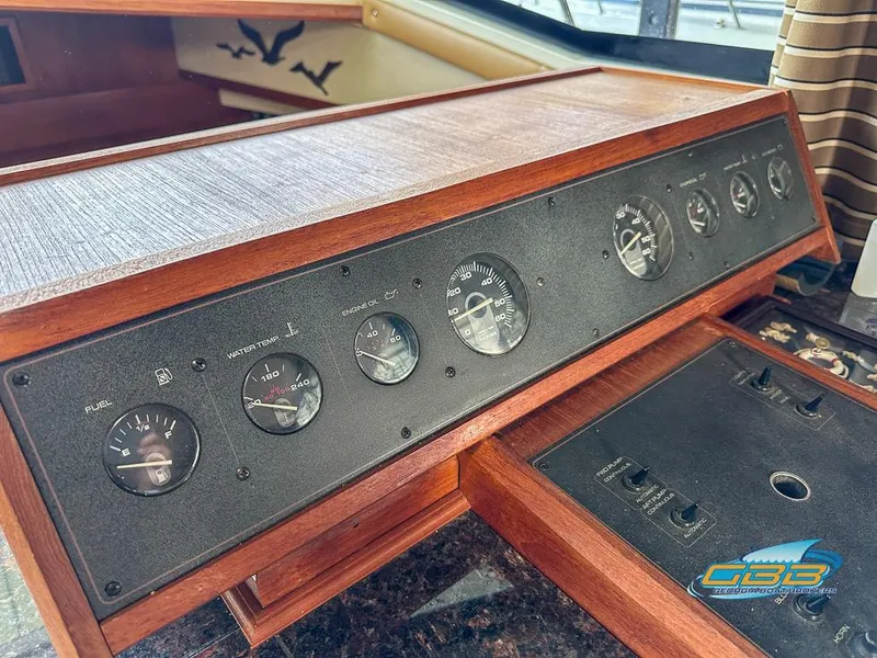 Slide: The Image of Dashboard of 1989 Carver 3807 Aft Cabin with gauges and controls. - 37