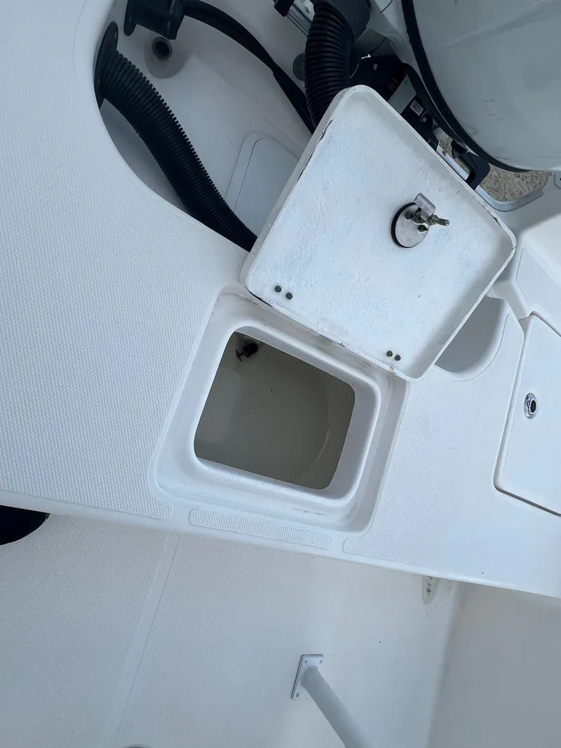Slide: The Image of 2022 Clearwater 2100 Baystar boat storage compartment with open hatch. - 11