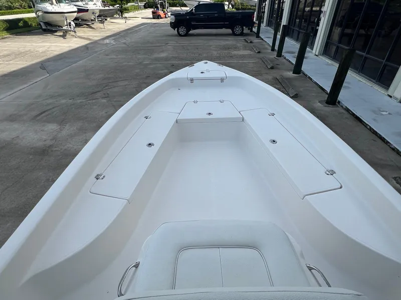 Slide: The Image of 2022 Clearwater 2100 Baystar boat, spacious deck view, parked outdoors. - 12