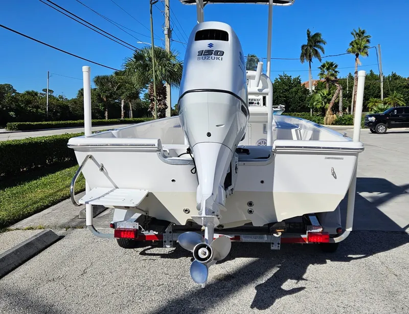 Slide: The Image of 2022 Clearwater 2100 Baystar boat with Suzuki 150 engine, parked outdoors. - 3
