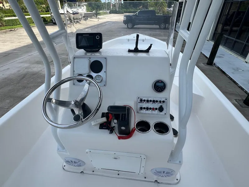 Slide: The Image of 2022 Clearwater 2100 Baystar boat console with steering wheel and controls. - 7