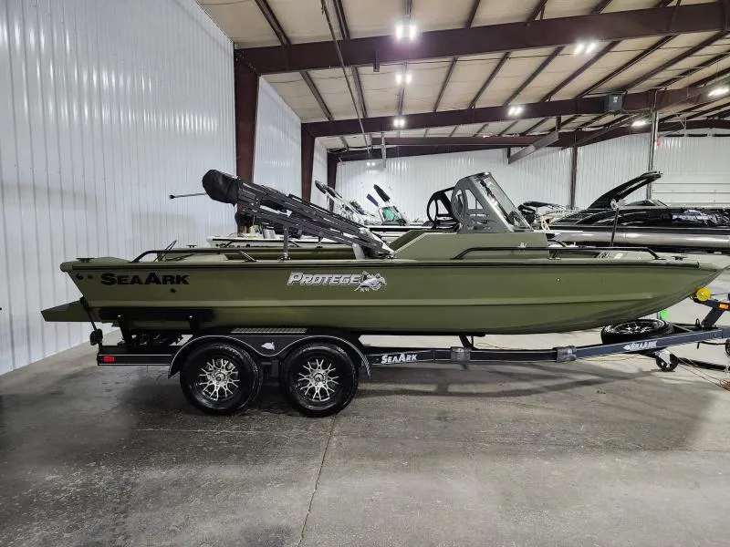 Slide: The Image of 2025 SeaArk Protege boat in a showroom, featuring a sleek green design on a trailer. - 4