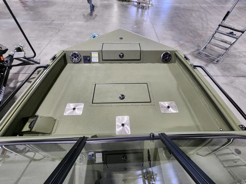 Slide: The Image of 2025 SeaArk Protege boat interior with storage compartments and speakers on display. - 8