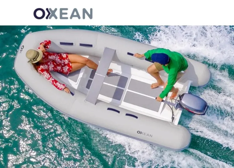 The Image of 2023 Custom 320 Aluminum Rib Inflatable boat on turquoise water, two people onboard. - 0