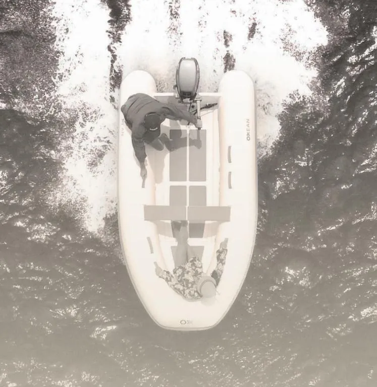 Slide: The Image of 2023 Custom 320 Aluminum Rib Inflatable boat on water, aerial view. - 2
