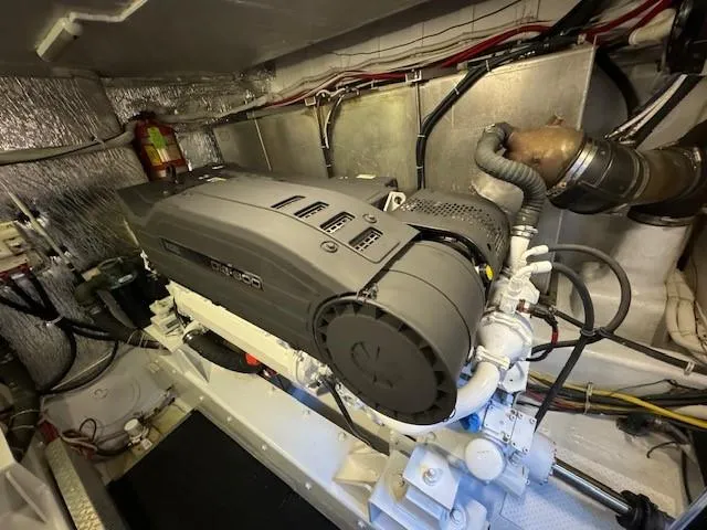 Slide: The Image of Engine room of 2007 Marquis 55 LS yacht, featuring a powerful motor. - 24