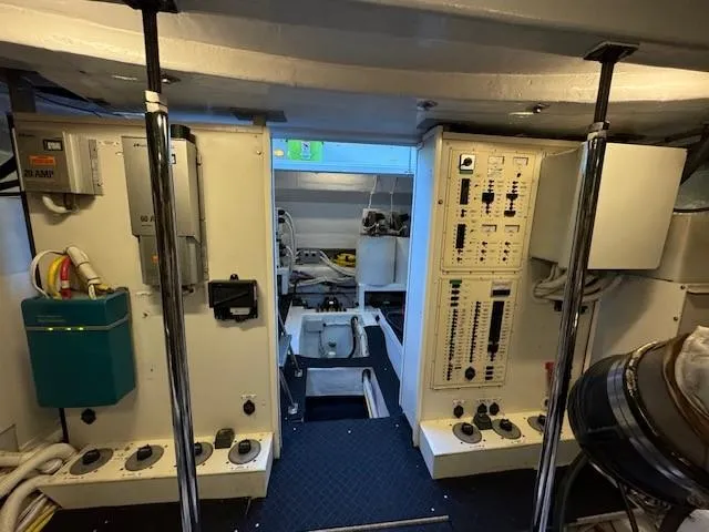 Slide: The Image of Engine room of 2007 Marquis 55 LS yacht with control panels and equipment. - 28