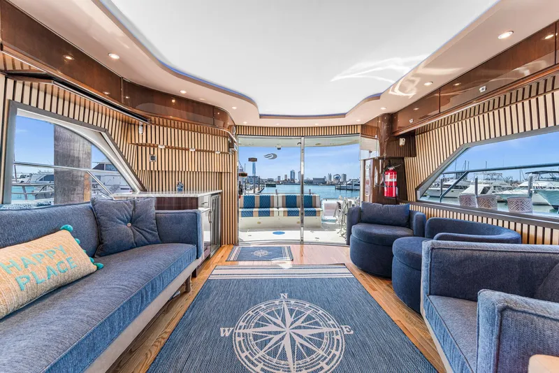 Slide: The Image of Luxurious interior of a 2007 Marquis 55 LS yacht with elegant seating and nautical decor. - 5