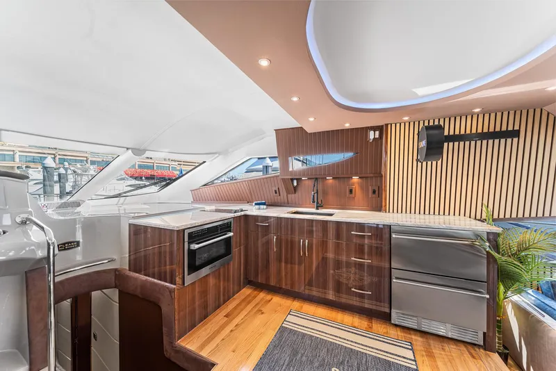Slide: The Image of Luxurious interior of a 2007 Marquis 55 LS yacht with modern kitchen design. - 9