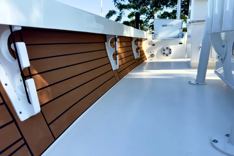 Slide: The Image of 2026 Pathfinder 2500 Hybrid boat with open storage compartments on deck. - 10