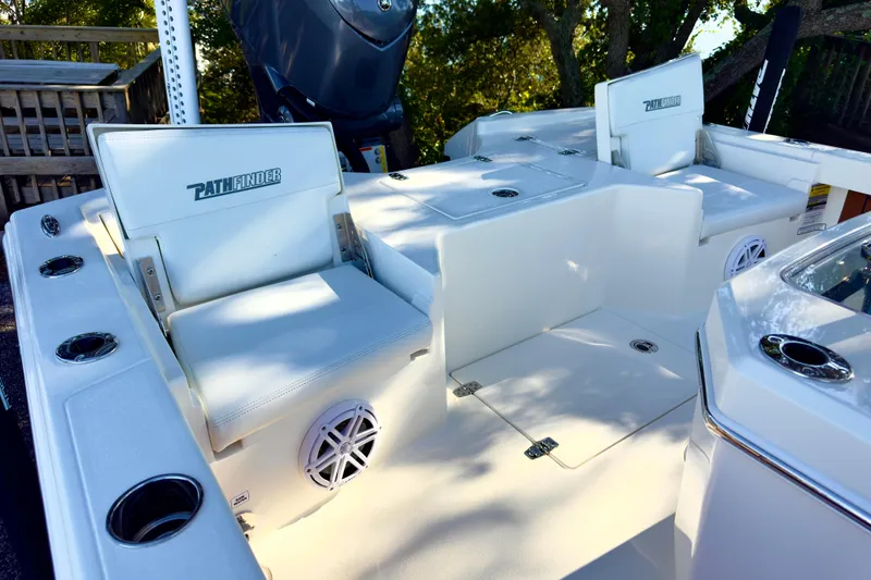 Slide: The Image of 2026 Pathfinder 2500 Hybrid boat with tower and seating, surrounded by trees. - 3