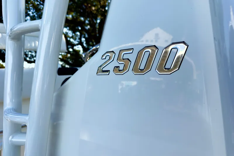 Slide: The Image of 2026 Pathfinder 2500 Hybrid boat seat with white upholstery and sleek design. - 8