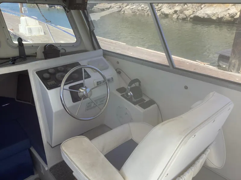 Slide: The Image of 2007 SeaSport Explorer 2400 boat interior with steering wheel and control panel. - 5