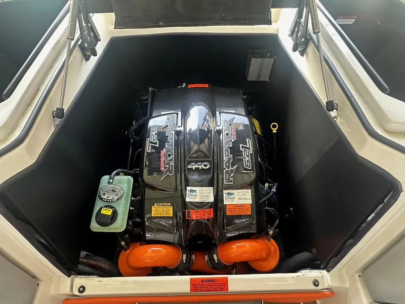 Slide: The Image of 2017 Tigé RZX3 boat engine compartment with powerful V8 engine. - 27