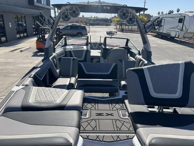 Slide: The Image of 2021 Tigé ZX Class 25 ZX boat interior with luxury seating and sound system. - 11