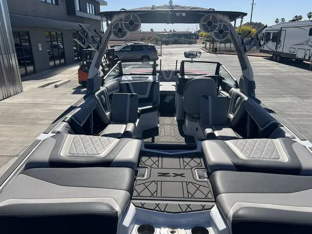 Slide: The Image of 2021 Tigé ZX Class 25 ZX boat interior with luxurious seating and advanced sound system. - 12