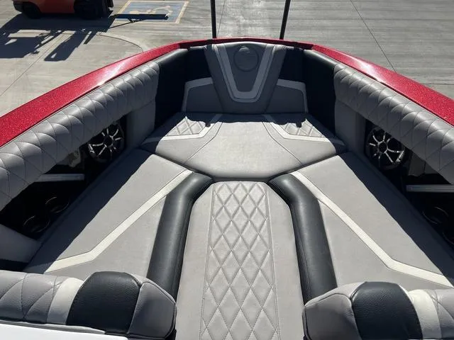 Slide: The Image of 2021 Tigé ZX Class 25 ZX boat interior with red and gray upholstery. - 8
