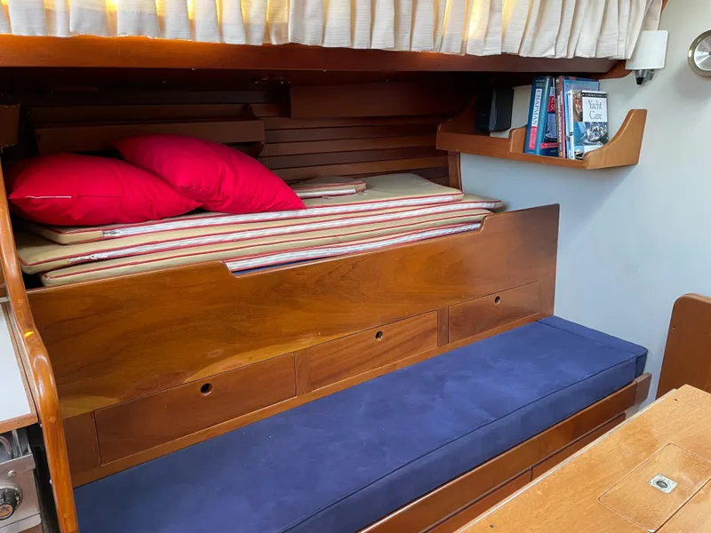 Slide: The Image of Interior of 1977 Hinckley Bermuda 40 MK III Sloop with wooden furnishings and cozy seating. - 35