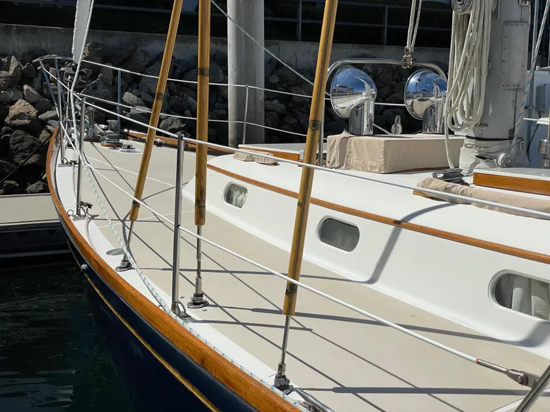 Slide: The Image of 1977 Hinckley Bermuda 40 MK III Sloop, detailed deck view with polished wood accents. - 48