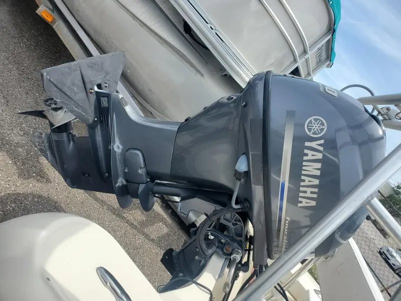 Slide: The Image of Yamaha outboard motor on 2013 Rigid Boats 12 Sport, parked on a trailer. - 12