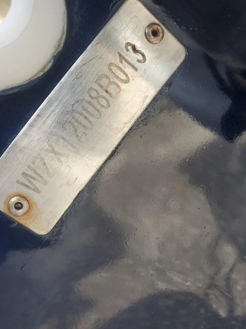 Slide: The Image of Serial number plate on 2013 Rigid Boats 12 Sport. - 13