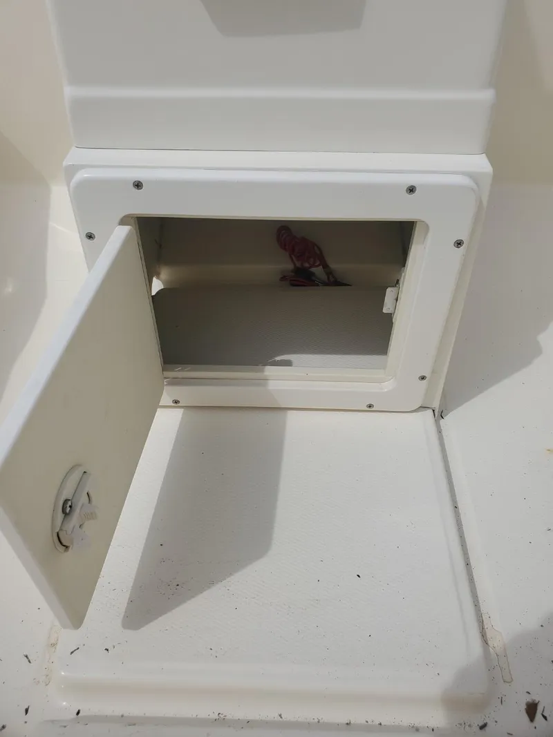 Slide: The Image of Open storage compartment on 2013 Rigid Boats 12 Sport. - 17