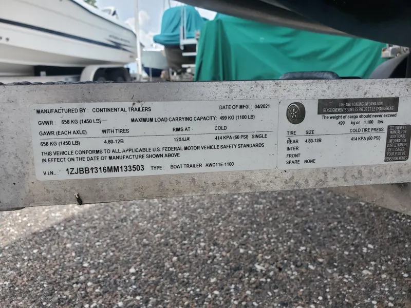 Slide: The Image of Label on Continental Trailers boat trailer, showing specifications and VIN for Rigid Boats 12 Sport, 2013. - 3