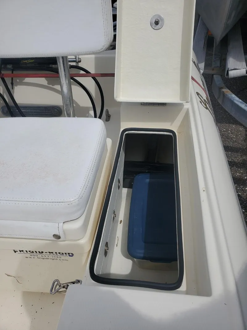 Slide: The Image of 2013 Rigid Boats 12 Sport interior with storage compartment and seating. - 5