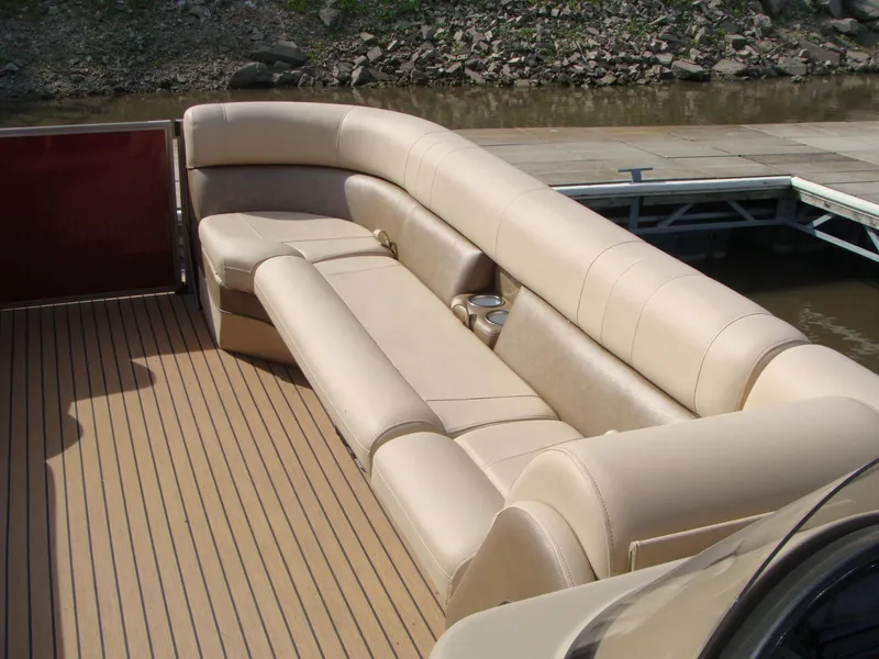 Slide: The Image of 2019 Bentley Pontoons 253 Admiral Elite with beige seating and cup holders on deck. - 3