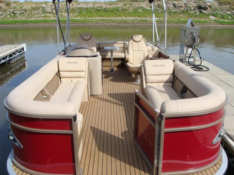 Slide: The Image of 2019 Bentley Pontoons 253 Admiral Elite with luxurious seating on a calm river. - 9