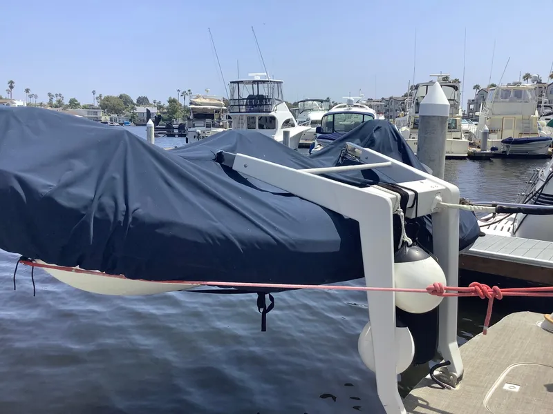 Slide: The Image of 1999 Carver 530 Voyager Pilothouse covered and docked at marina. - 2