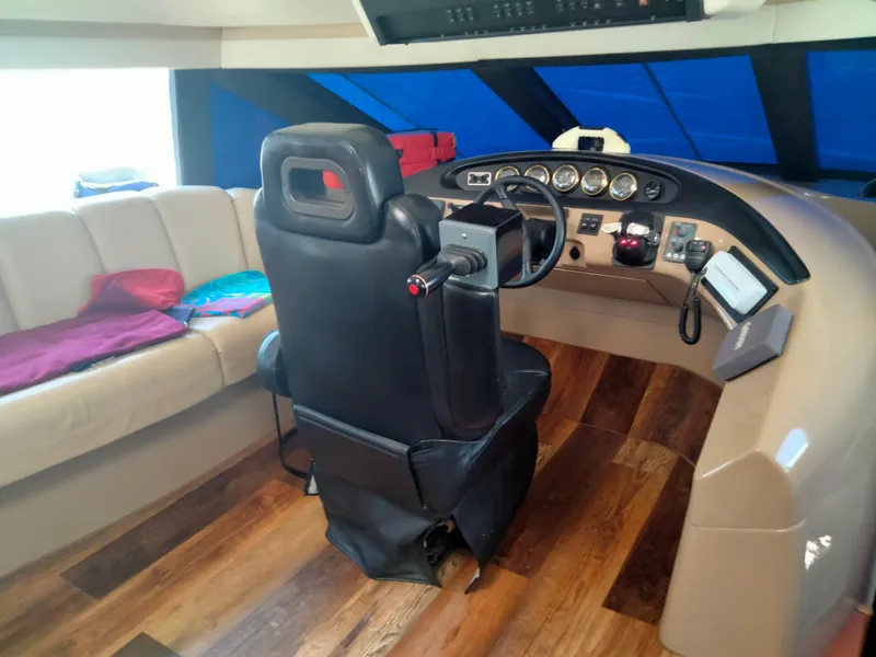 Slide: The Image of Interior of 1999 Carver 530 Voyager Pilothouse with helm station. - 22