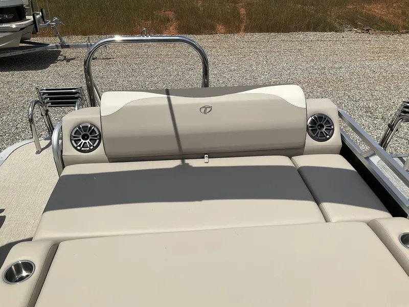 Slide: The Image of 2024 Tahoe Pontoon LTZ boat with versatile rear lounger and built-in speakers. - 12