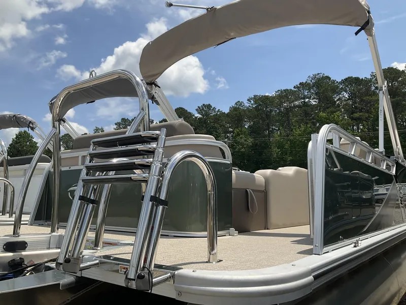 Slide: The Image of 2024 Tahoe Pontoon LTZ 23 FT Versatile Rear Lounger, sleek design, sunny day. - 4