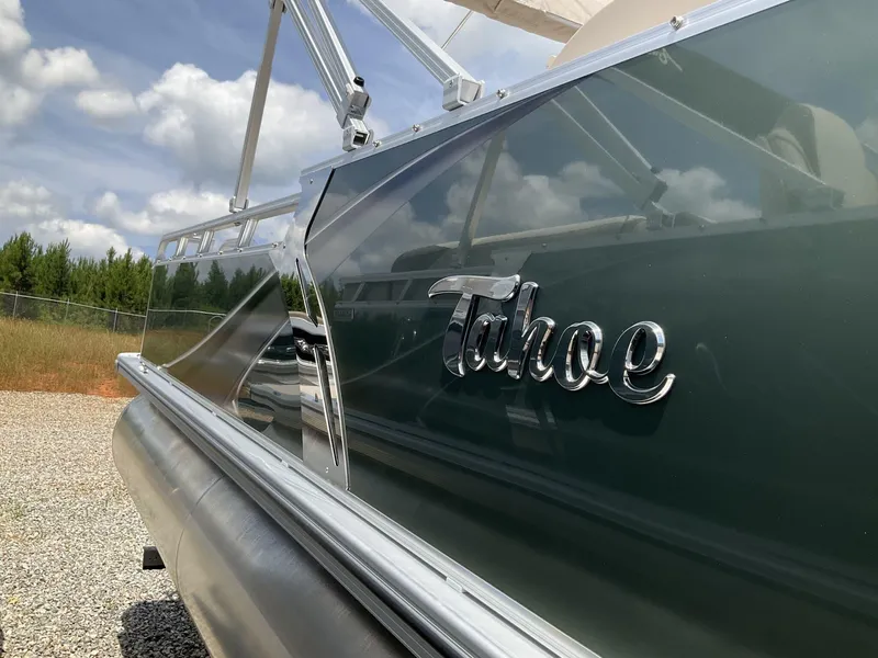 Slide: The Image of 2024 Tahoe Pontoon Boats LTZ - 23 FT Versatile Rear Lounger, side view with logo. - 5