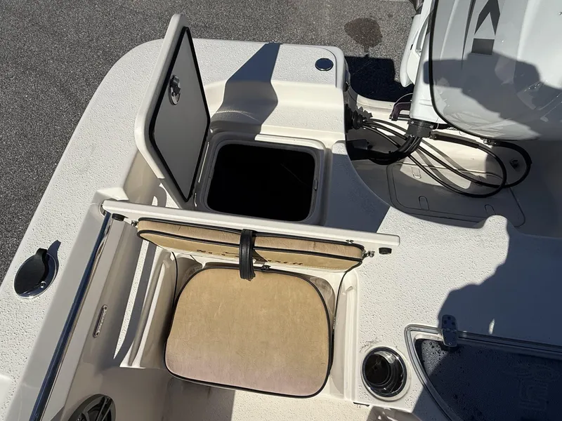 Slide: The Image of 2023 Sea Chaser Bay Runner Series 21 LX boat storage compartment and seating detail. - 10