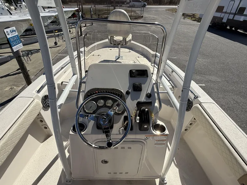 Slide: The Image of 2023 Sea Chaser Bay Runner Series 21 LX boat console with steering wheel and controls. - 11