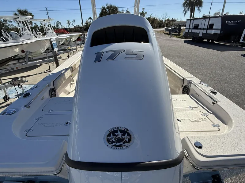 Slide: The Image of 2023 Sea Chaser Bay Runner Series 21 LX boat, featuring a 175 engine, parked outdoors. - 4