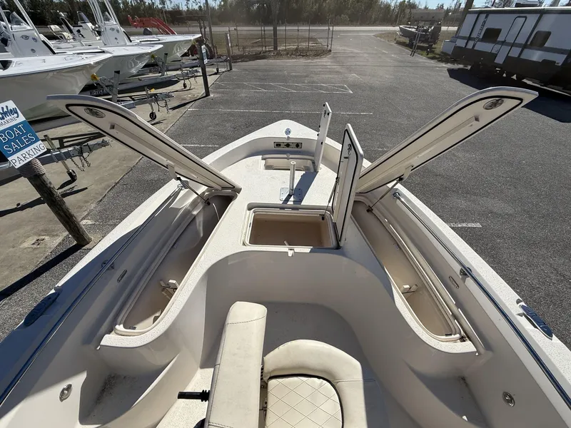 Slide: The Image of 2023 Sea Chaser Bay Runner Series 21 LX boat interior with open storage compartments. - 7