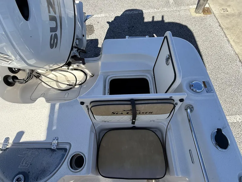 Slide: The Image of 2023 Sea Chaser Bay Runner Series 21 LX boat with open storage compartments. - 9