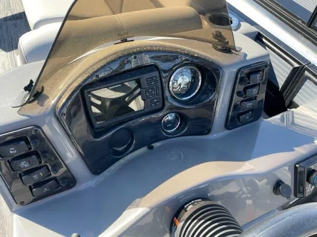 Slide: The Image of 2023 Qwest Pontoons E-Class XRE Cruise 822 LT dashboard with navigation system and controls. - 11