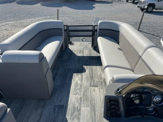 Slide: The Image of 2023 Qwest Pontoons E-Class XRE Cruise 822 LT interior with gray seating and wood-style flooring. - 12